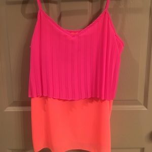 Pink and orange tank top.. Skies are blue brand